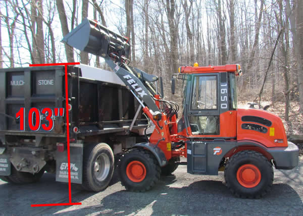 Wheel loader 1650 on trailer with dump truck